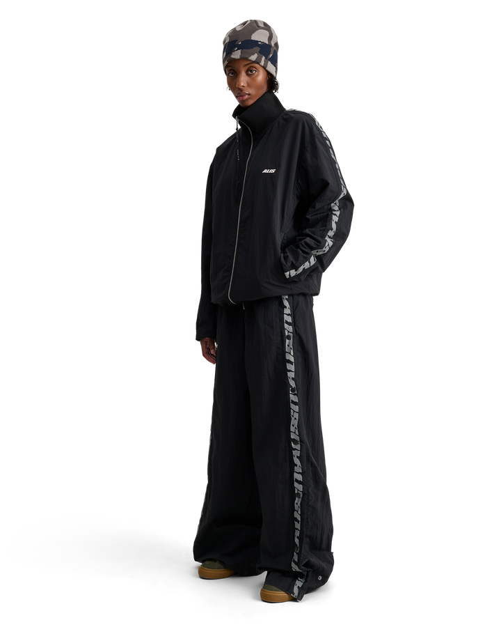 ALIS TEEFEY TRACK PANTS W/ LOGO TAPE Trousers